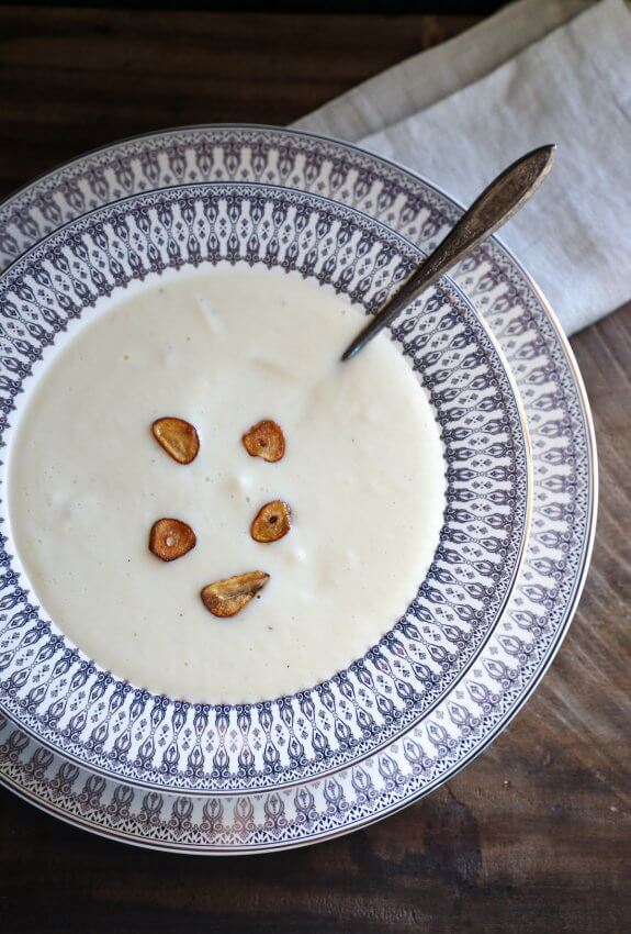 Instant Pot Keto Cheesy Cauliflower Soup with fried garlic garnish