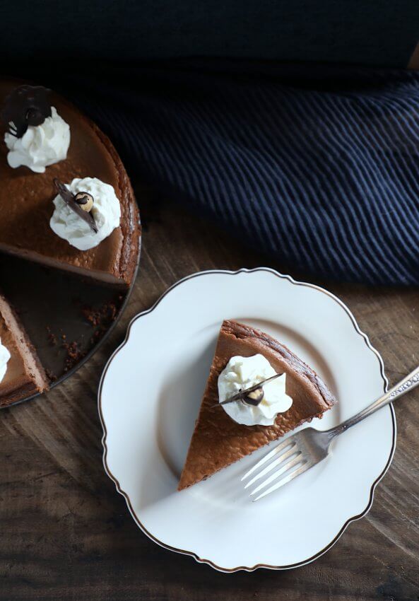 keto chocolate hazelnut cheesecake slice on a white plate