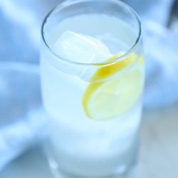 keto ginger lemon detox drink in a clear glass with ice