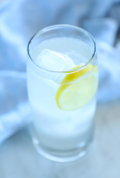 keto ginger lemon detox drink in a clear glass with ice
