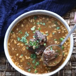 Instant Pot Keto Beef Barley Soup with a spoon from above