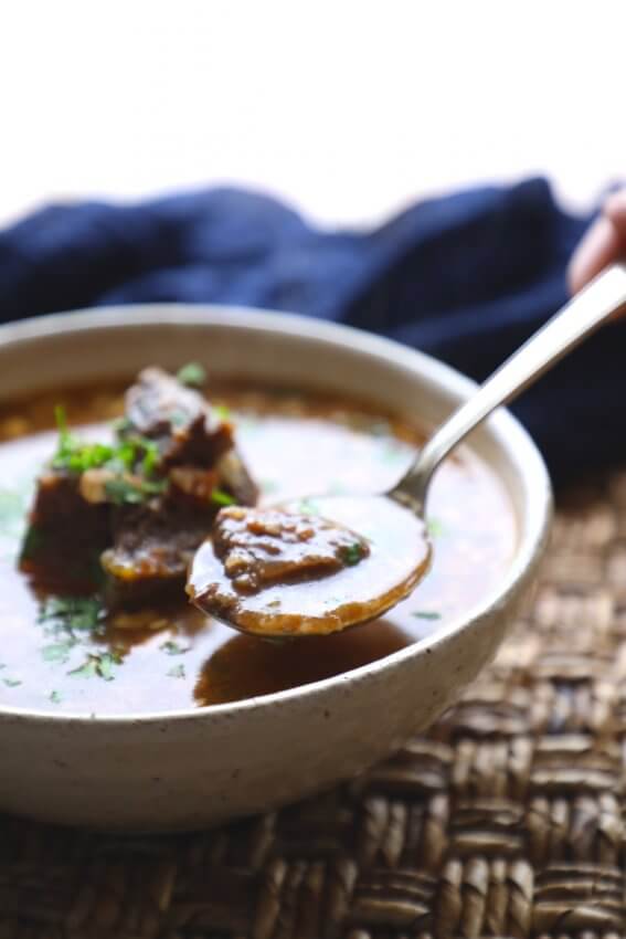 Instant Pot Keto Beef Barley Soup in a pottery bowl