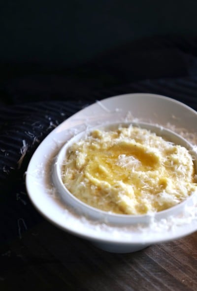 Cheesy Keto Polenta front view garnished with grated parmesan cheese