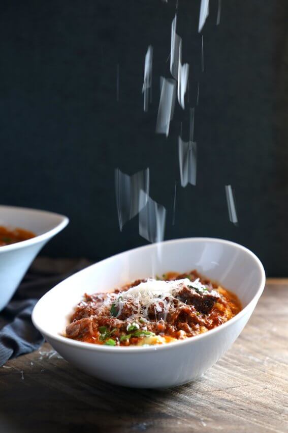 Keto Short Rib Ragu in the Instant Pot with parmesan cheese raining down onto it from above
