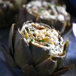Keto Stuffed Artichokes on a silver platter