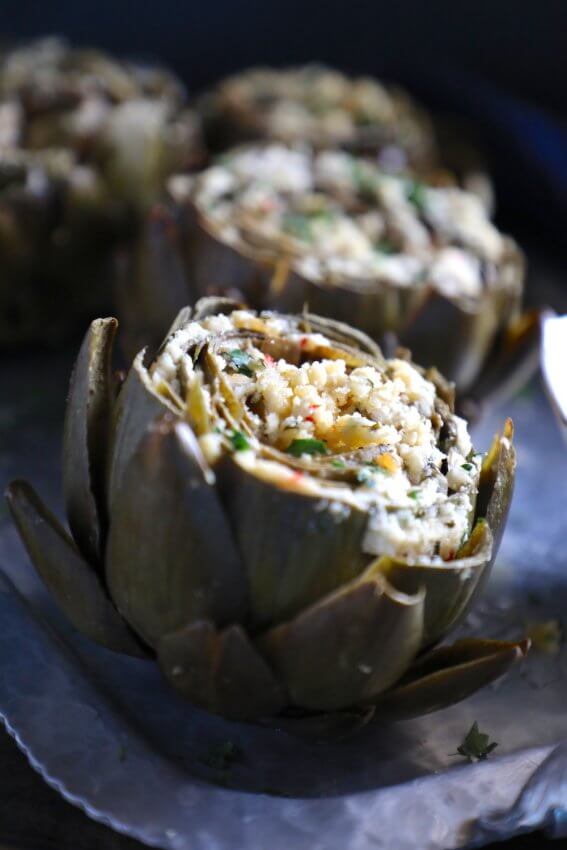 Keto Stuffed Artichokes on a silver platter