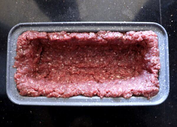 Ground beef in a loaf pan - Keto Lasagna Meatloaf step 1