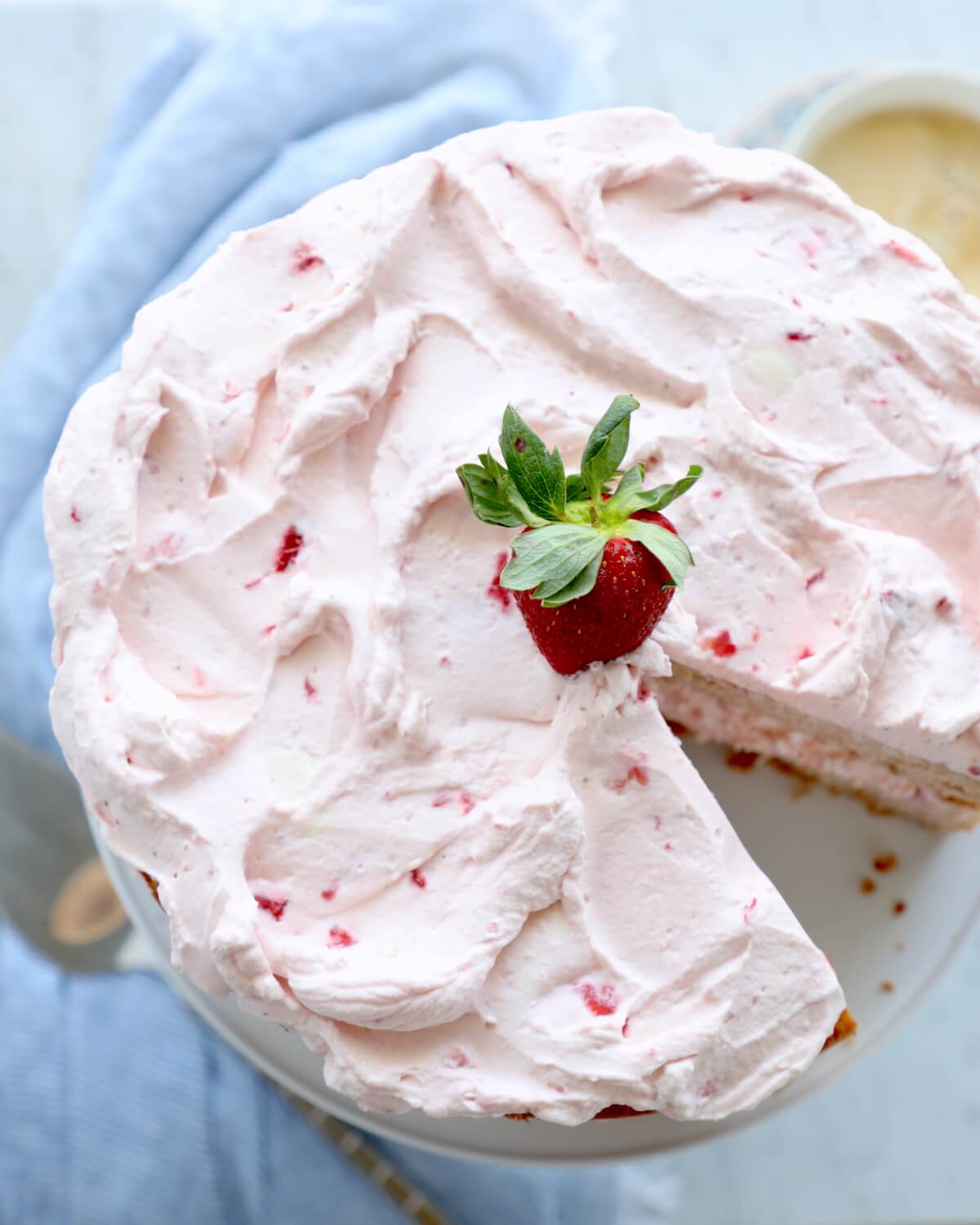 Top view of Keto Strawberry Mousse Cake with a slice removed