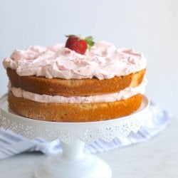 Keto Strawberry Mousse Cake on a white cake pedestal
