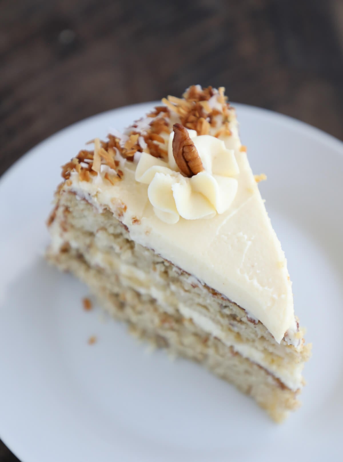 Slice of Keto Hummingbird Cake on a white plate top view