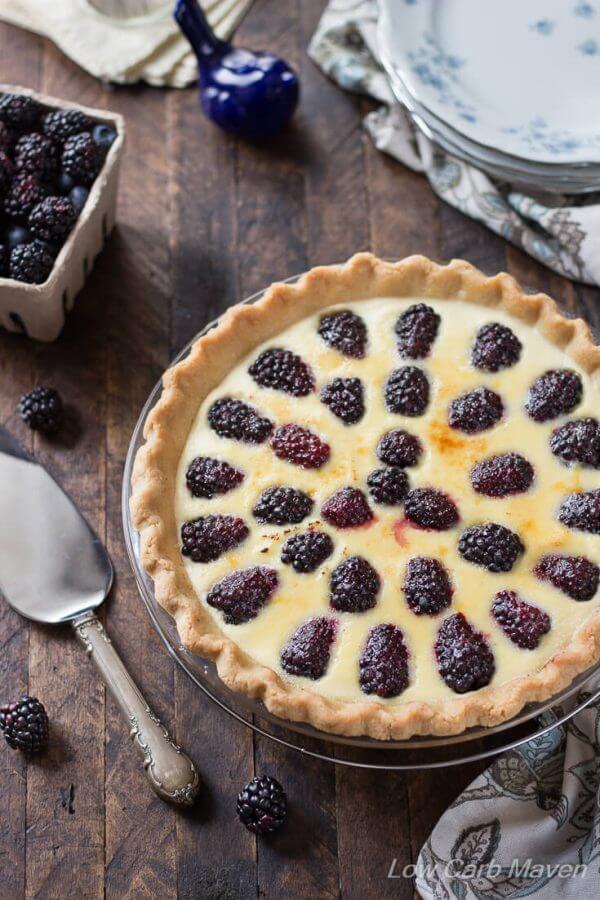 blackberry custard pie on wooden background