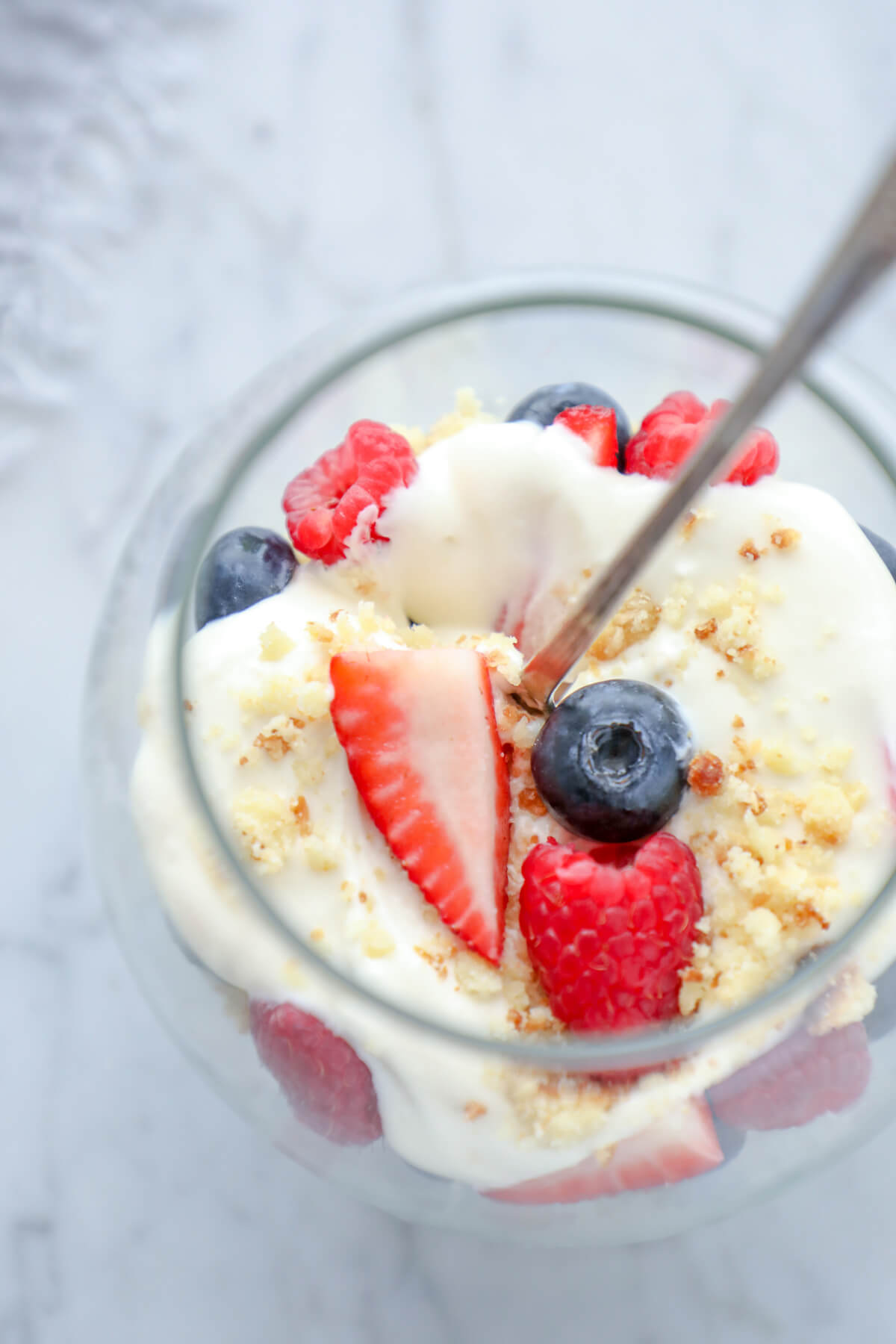 Keto Cheesecake Parfaits top view with blueberries and sliced strawberries