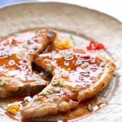 Sweet Chili Keto Pork Chops garnished with scallions