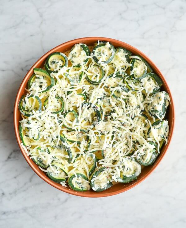 Keto Zucchini Rollatini in a copper pan before baking