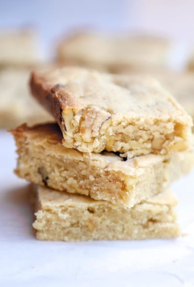 3 keto butter rum blondies stacked on top of each other to show texture
