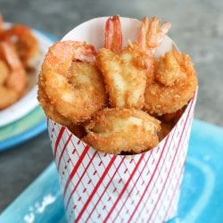 Keto Coconut Shrimp in a red and white striped paper dispenser