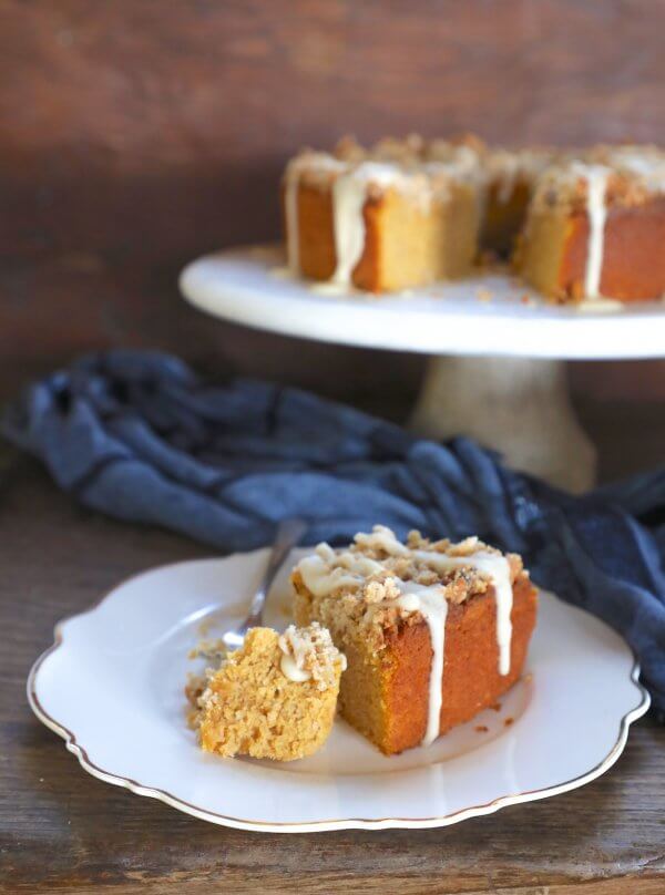 keto pumpkin chai coffee cake on a white plate with gold rim