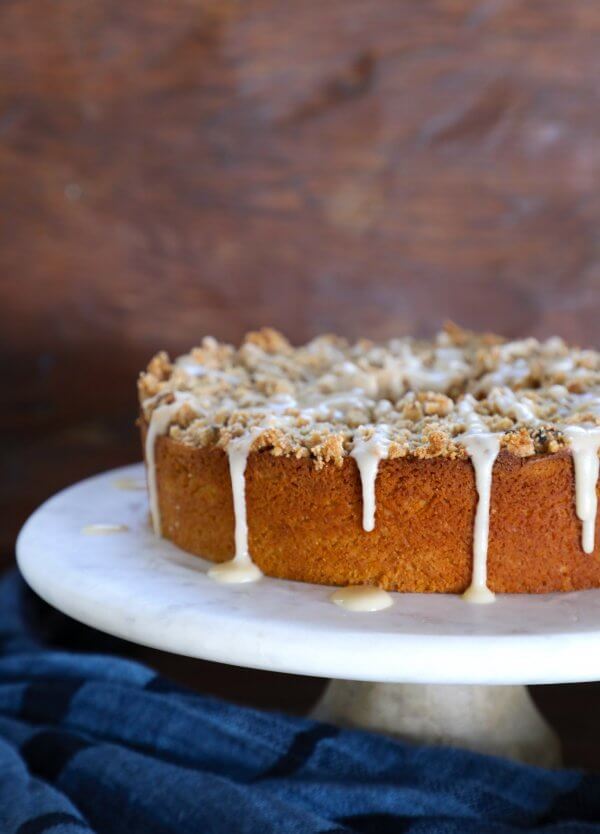 Keto Pumpkin Chai Coffee Cake on a white marble cake plate
