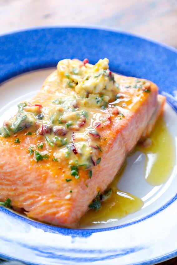 side view of keto salmon with orange cranberry butter