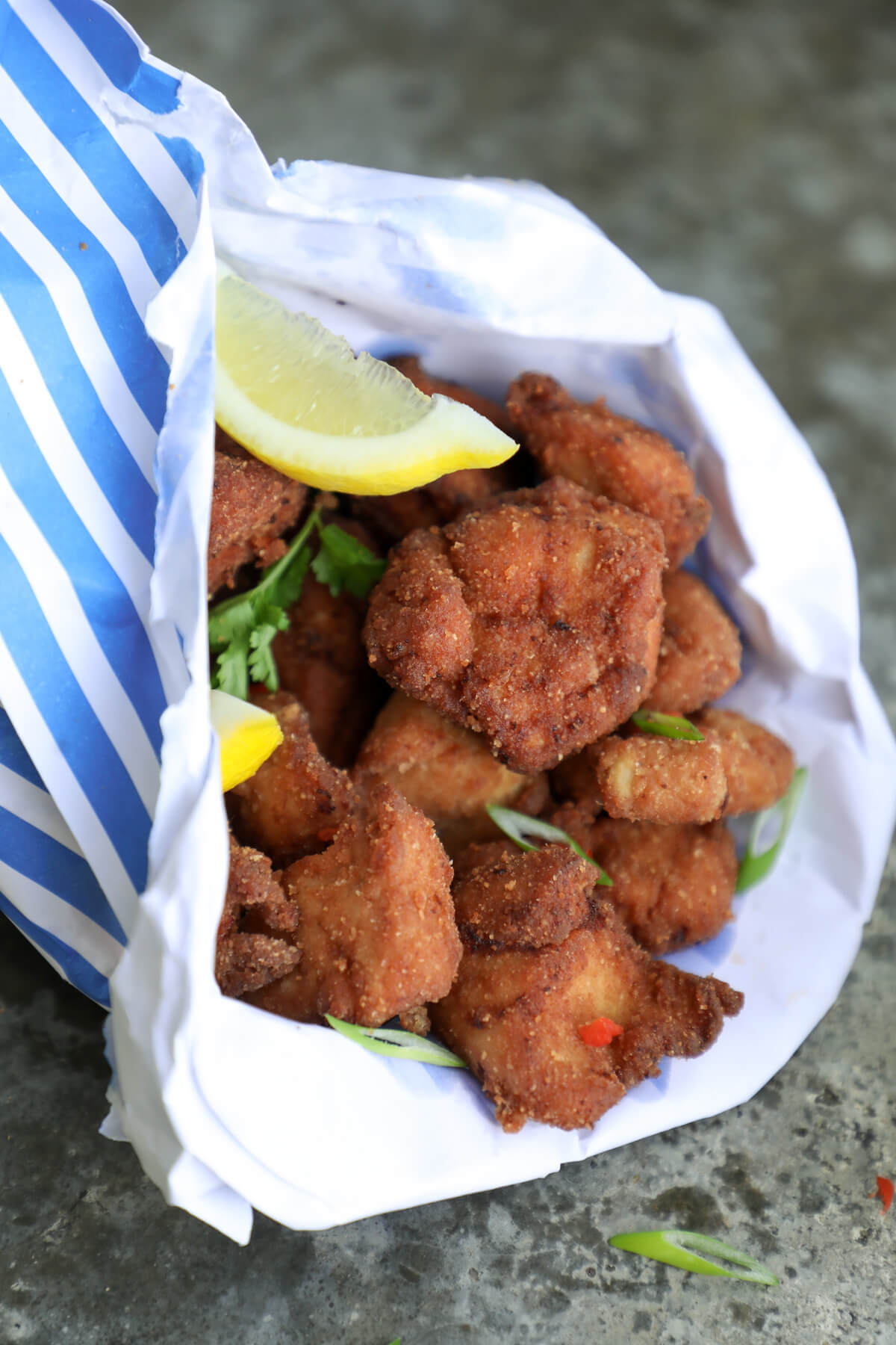 keto chicken karaage with lemon wedges and scallions