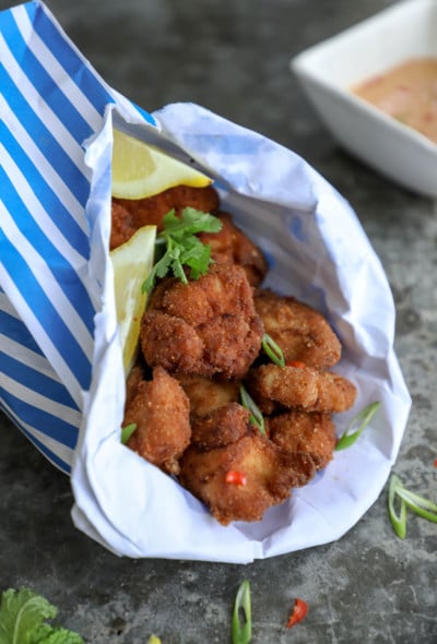 Keto Chicken Karaage in a blue and white striped paper bag