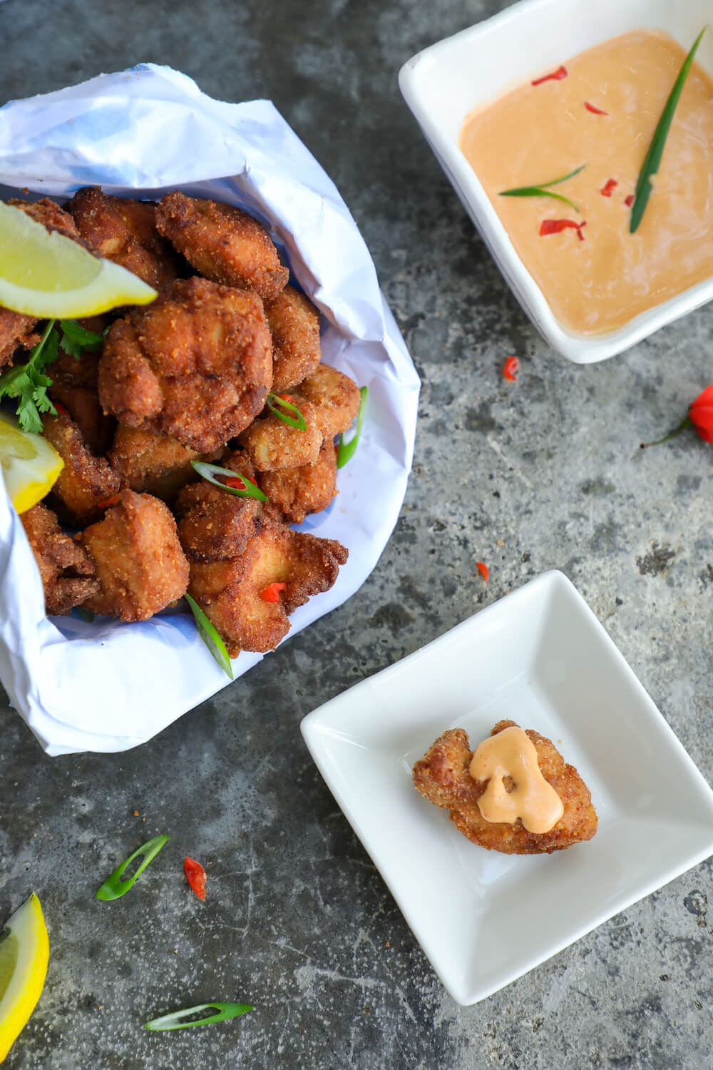 keto chicken karaage on a square plate with sauce