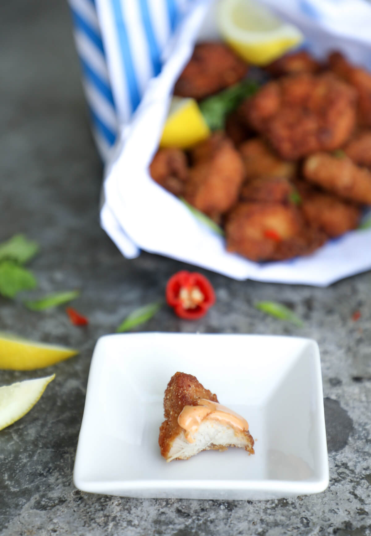 keto chicken karaage with sauce and a bite taken out of it.