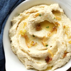 Keto Cheddar Leek Cauliflower Mash with fried leeks on top