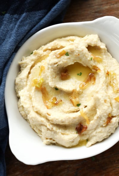 Keto Cheddar Leek Cauliflower Mash with fried leeks on top