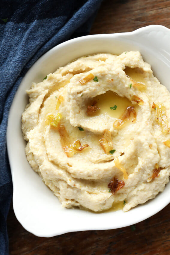 Keto Cheddar Leek Cauliflower Mash with fried leeks on top