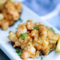 Keto Cajun Shrimp Stuffed Portobellos on a white rectangular platter