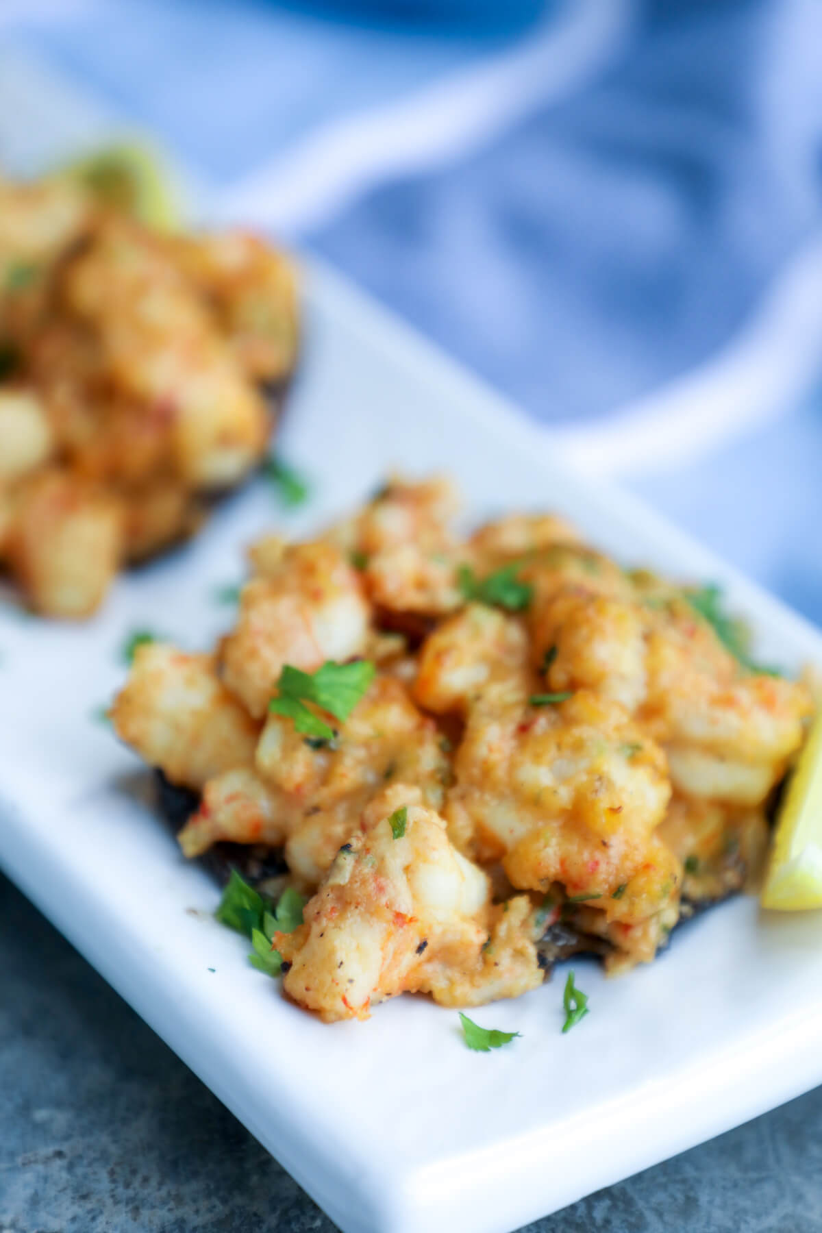 Keto Cajun Shrimp Stuffed Portobellos on a white rectangular platter
