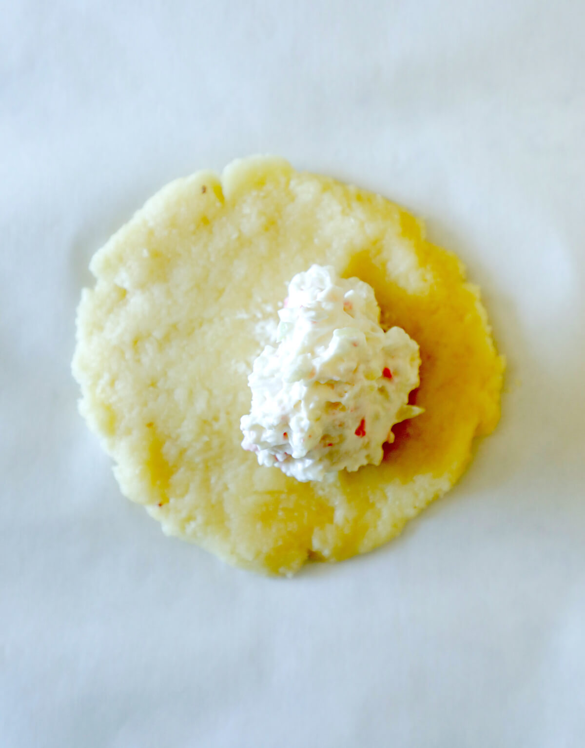crab filling shown on the flattened dough