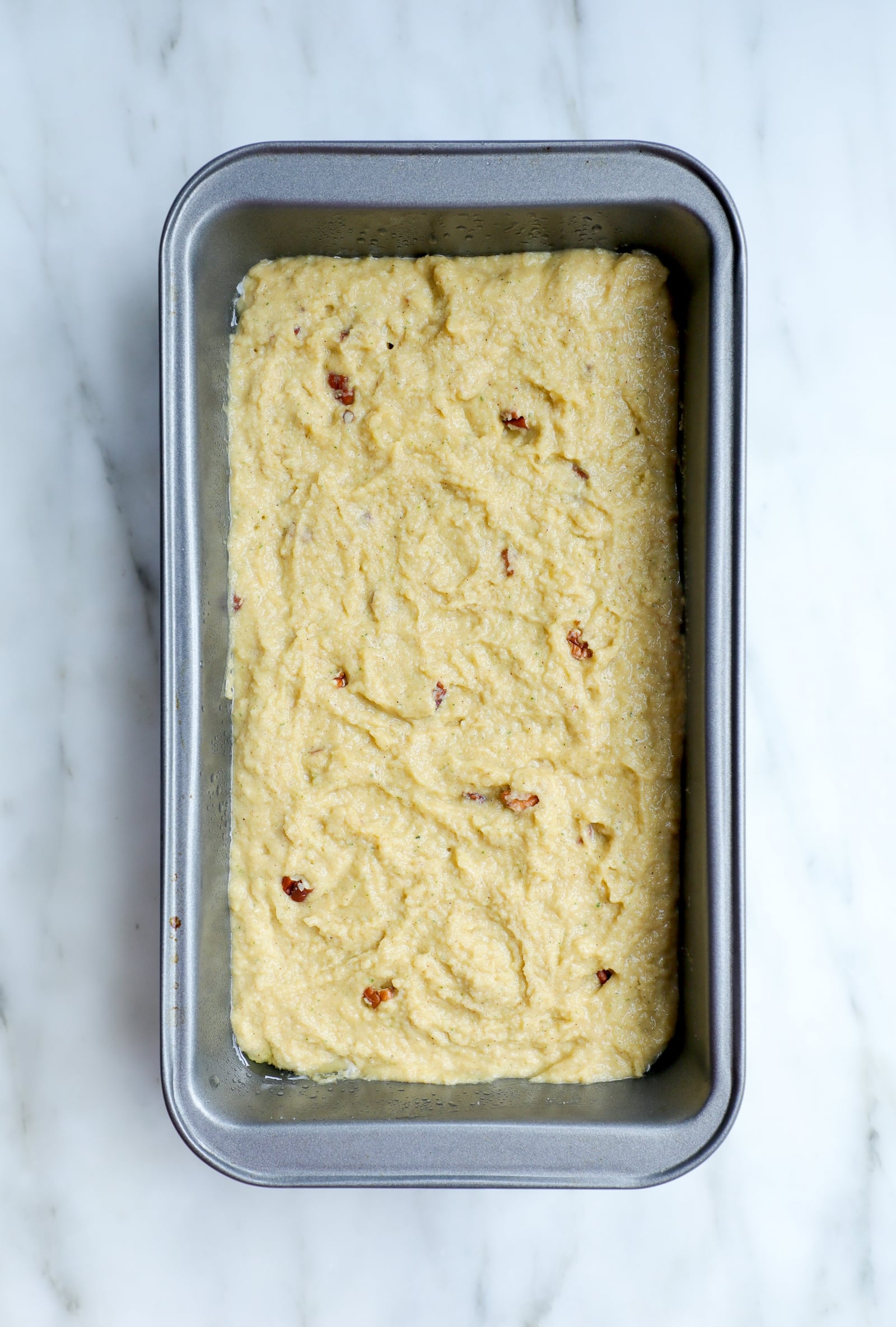 Bread pan with batter before baking