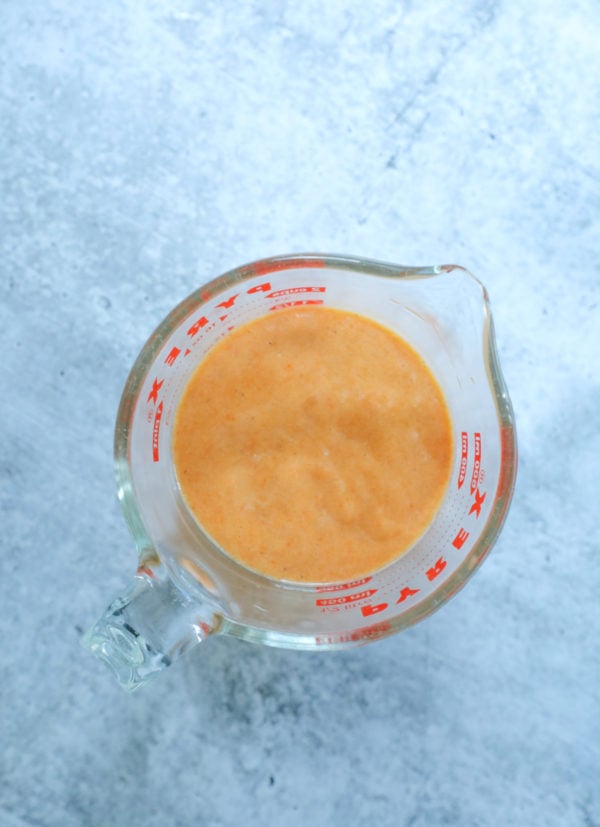 Keto Sandwich Wraps batter in a pyrex measuring cup before cooking, shows the consistency of the batter as step 2 in the process