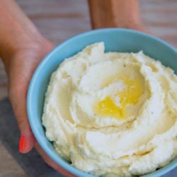 Keto Cauliflower Mash with melted butter in a pool on top