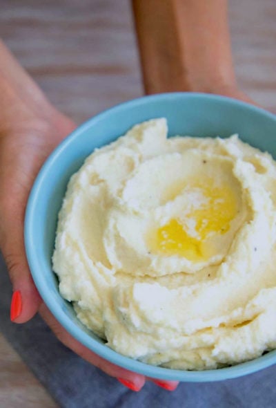 Keto Cauliflower Mash with melted butter in a pool on top