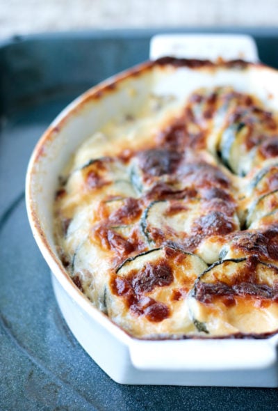 Easy Keto Zucchini Gratin in a white casserole dish after baking