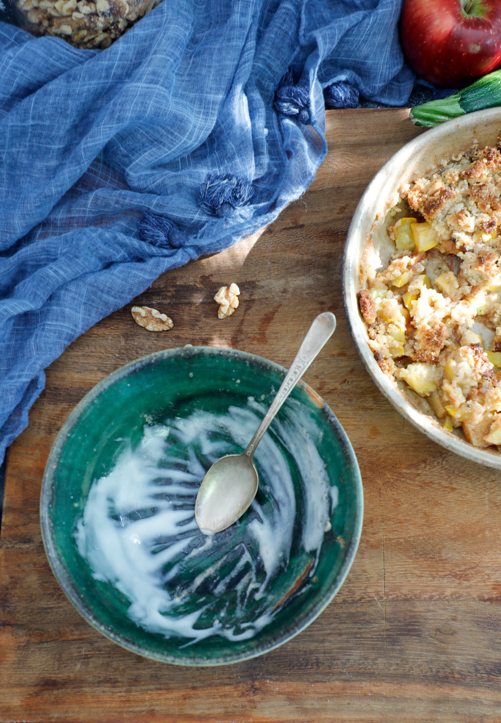 empty bowl after apple crisp is eaten leaving only bits of melted iced cream inside