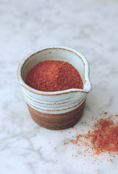 cajun seasoning on white marble board