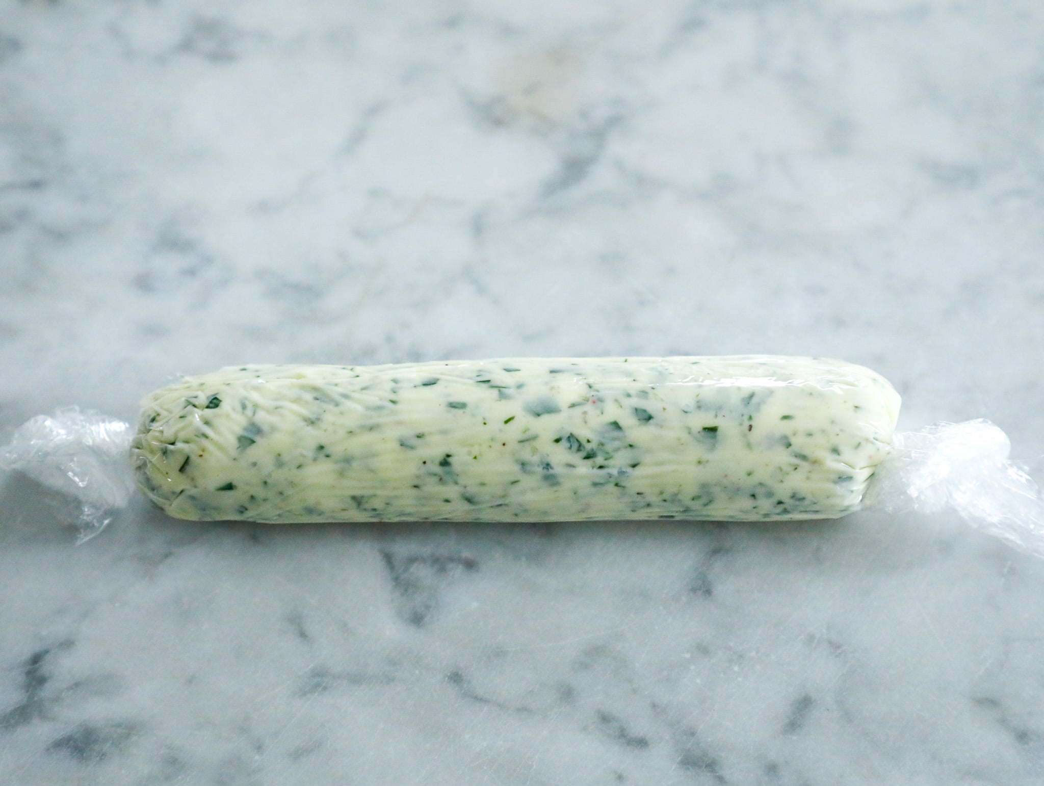 Hotel Butter rolled into a log and ready to be frozen and cut into slices