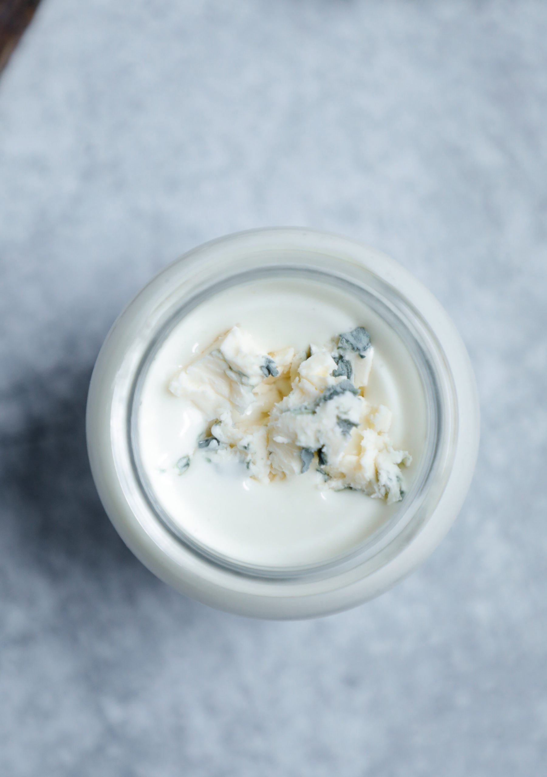 Top view of dressing with blue cheese crumbled over it