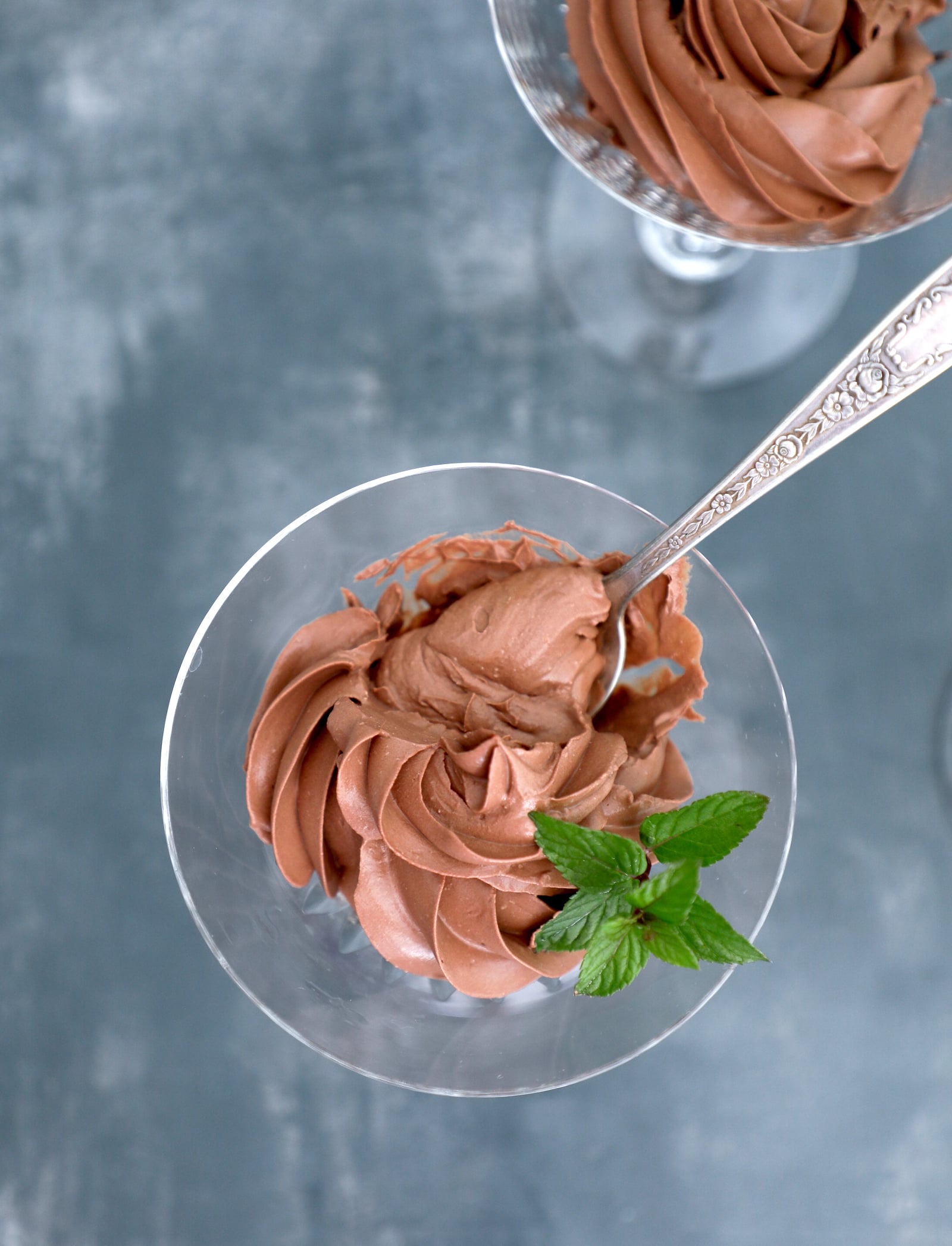 top view of easy chocolate mousse with a spoon in the glass